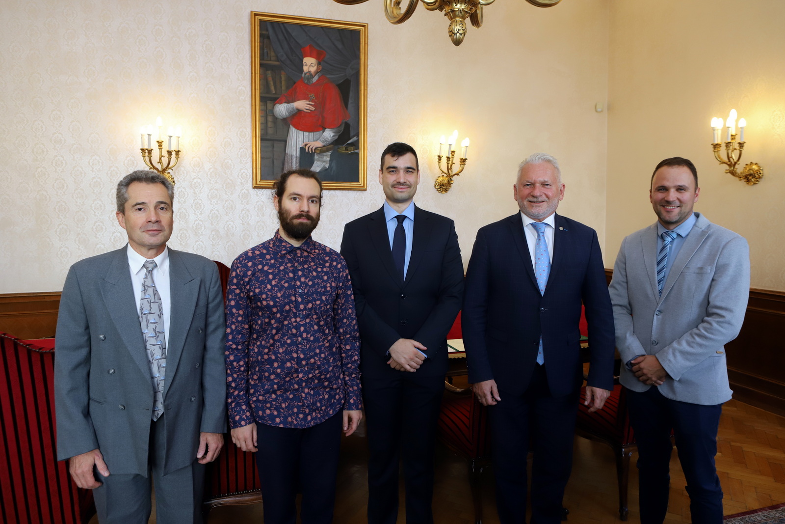 The four recipients of the award with rector László Borhy.